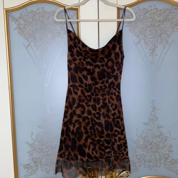 princess polly baby blue dress The Vanessa Maxi Dress in Brown features a striking deep V-neckline,  elevated by a cascading chiffon ruffle that adds soft movement and drama.  Designed with adjustable ties at the back of the main image 1